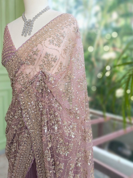 Tarangini Light Purple Net Saree With Cutdana and Sequin Work