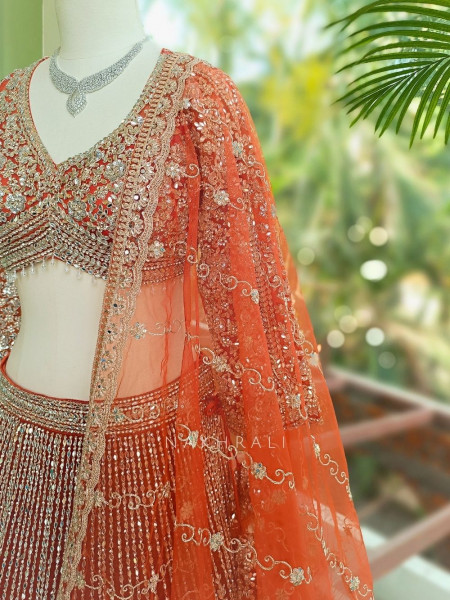 Selene Orange  Bridal Lehenga with Silver Embroidery