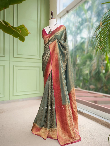Tantushri Teal Green Saree With Woven Motifs and Contrast Border