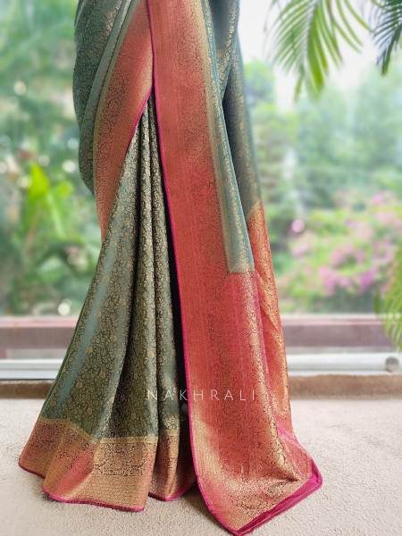 Tantushri Teal Green Saree With Woven Motifs and Contrast Border