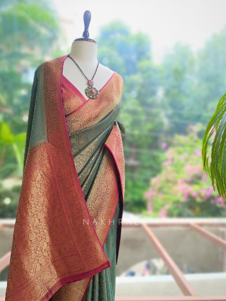 Tantushri Teal Green Saree With Woven Motifs and Contrast Border