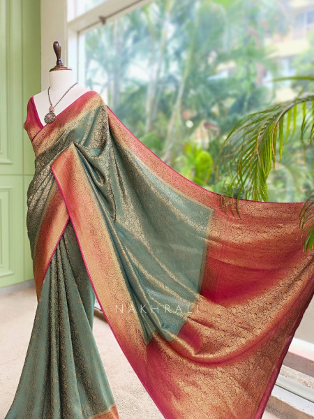 Tantushri Teal Green Saree With Woven Motifs and Contrast Border