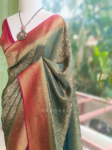 Tantushri Teal Green Saree With Woven Motifs and Contrast Border