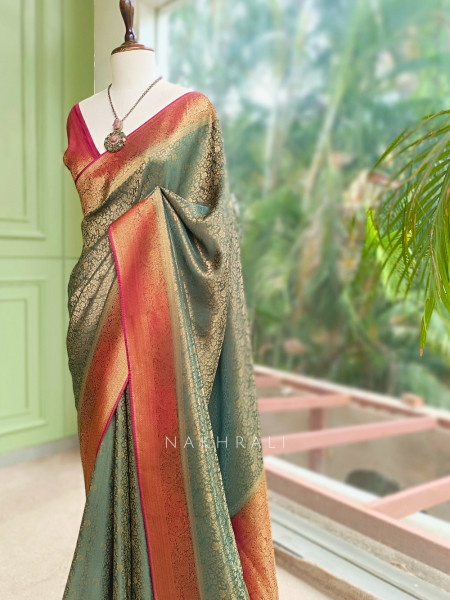 Tantushri Teal Green Saree With Woven Motifs and Contrast Border