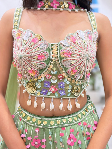 Amoret  Green Raw Silk & Tulle Carnival Lehenga Set With 3D Floral, Cutdana & Cowrie Work