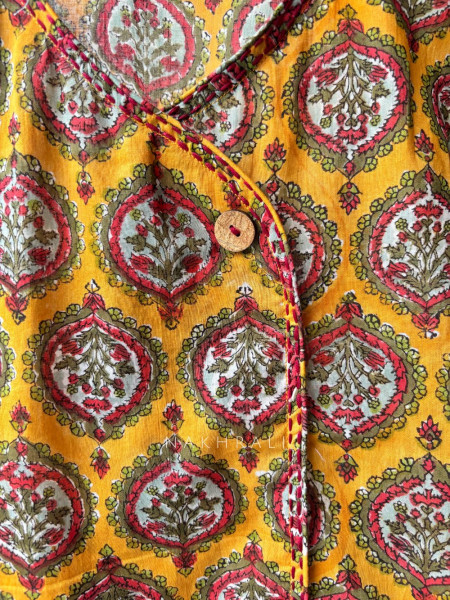 Flexora Yellow Printed Sleeveless Top with Overlap Neck Detail