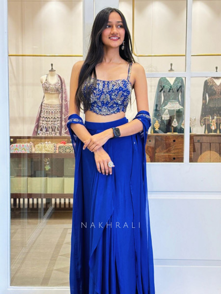Blue Crop Top Dhoti Skirt Set with Shrug in Georgette Blue Crop Top Dhoti Skirt Set with Shrug in Georgette
