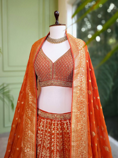 Vedhika Glint Orange Brocade Lehenga with Zari and Sequin Work