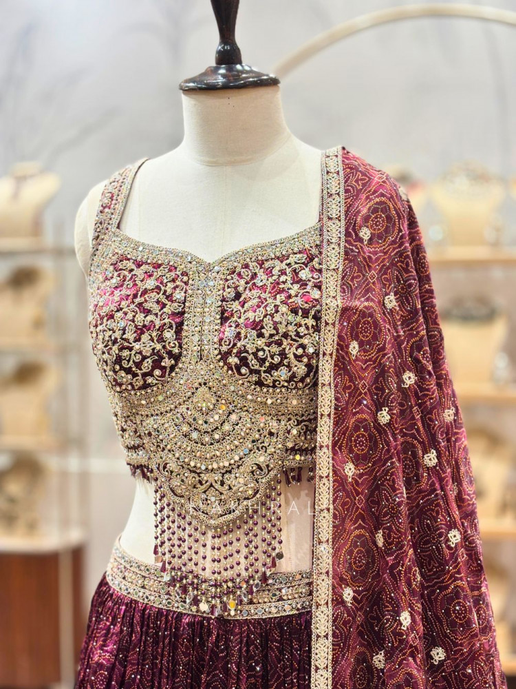 Image of Indrani Wine Lehenga Set with Bandhej Print and Mirror Embroidery