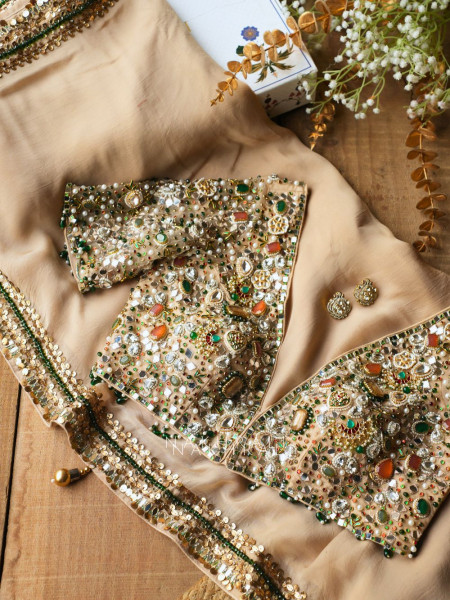 Noor-e-Kundan Brown Saree with Jewelled Blouse and Sequin Border
