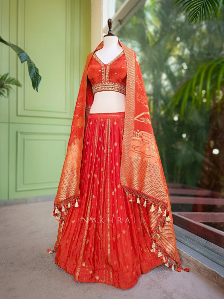 Kavira Orange Lehenga with Woven Dupatta and Subtle Zari Work