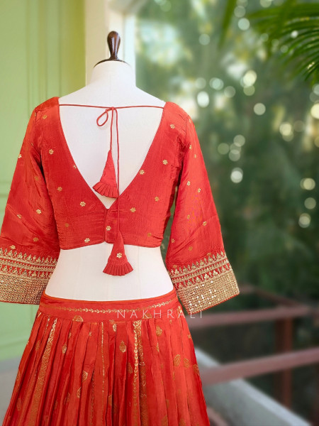 Kavira Orange Lehenga with Woven Dupatta and Subtle Zari Work