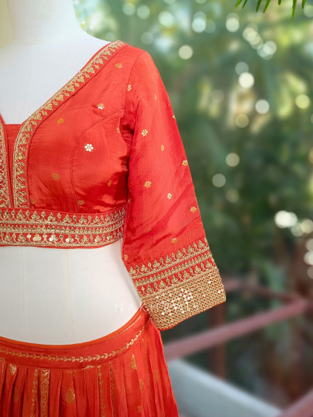Kavira Orange Lehenga with Woven Dupatta and Subtle Zari Work