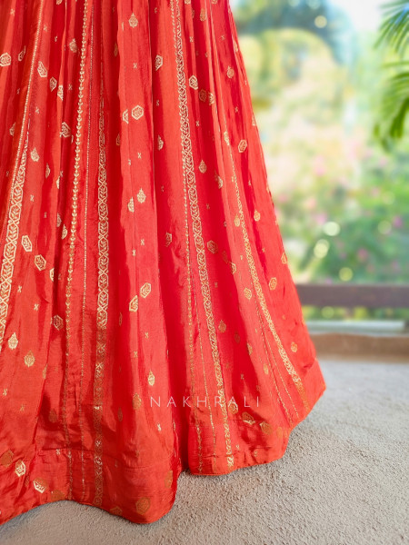 Kavira Orange Lehenga with Woven Dupatta and Subtle Zari Work