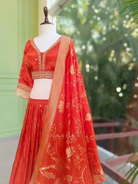 Kavira Orange Lehenga with Woven Dupatta and Subtle Zari Work