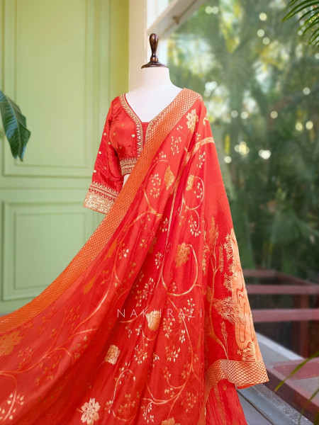 Kavira Orange Lehenga with Woven Dupatta and Subtle Zari Work
