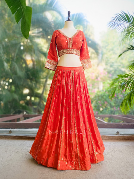 Kavira Orange Lehenga with Woven Dupatta and Subtle Zari Work