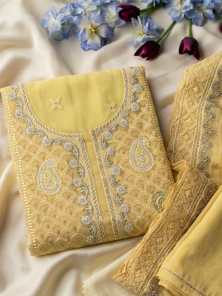 Mridula Yellow Dress Material With Embroidered Neckline and Border Detail
