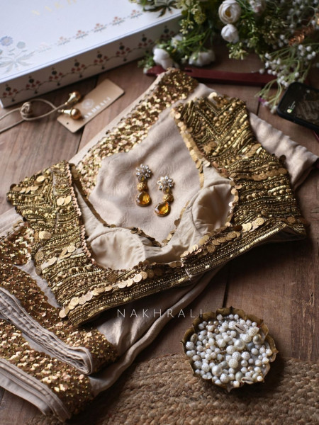 Sunheri Elara Beige Satin Crepe Saree with Statement Blouse & Pitta & Antique Gold Coin Work