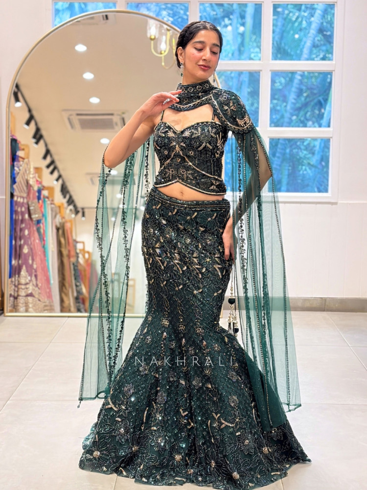 Image of Gisele Bottle Green Net &amp; Tulle Fish-Cut Cape Lehenga