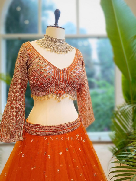 Lustre Enchant Orange Net Lehenga with Heavy Embroidered Blouse