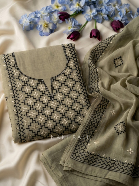 Karigari Green Dress Material With Contrast Embroidery and Border Detail