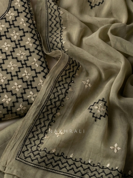 Karigari Green Dress Material With Contrast Embroidery and Border Detail
