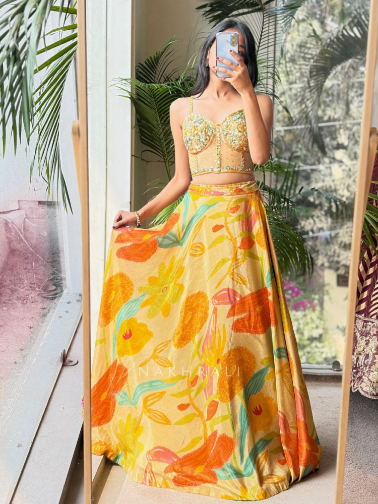Image of Kesari Yellow Floral Lehenga Set with Embellished Corset Blouse