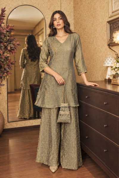 Pure Tissue festive coord set with intricate hand work and potli