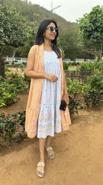 Pure Mul Cotton Jamdani dress with3/4 sleeves paired with checkered jacket with crochet patch