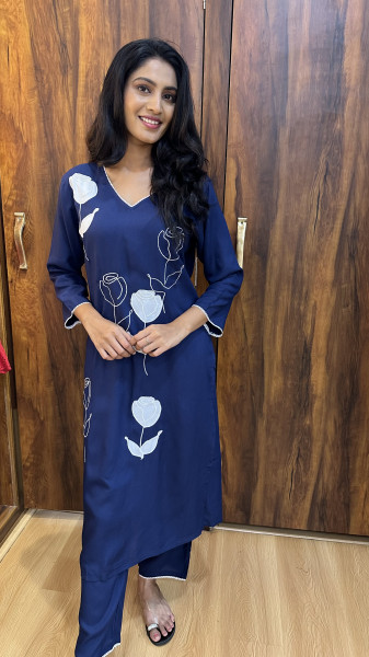Soft cotton kurta with appliqué and thread work paired with pants