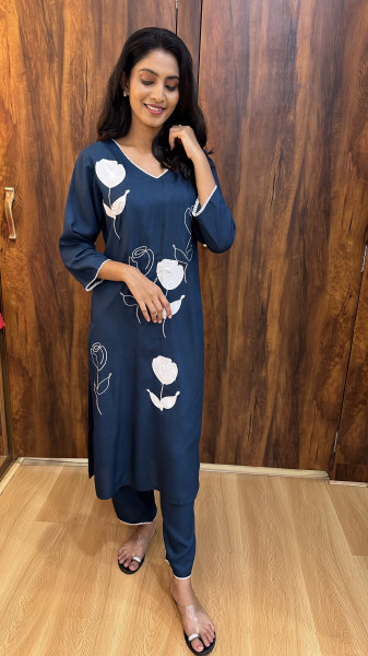 Soft cotton kurta with appliqué and thread work paired with pants