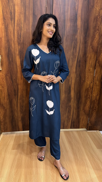 Soft cotton kurta with appliqué and thread work paired with pants