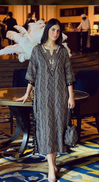 Soft cotton Pakistani long kurta paired with potli bag