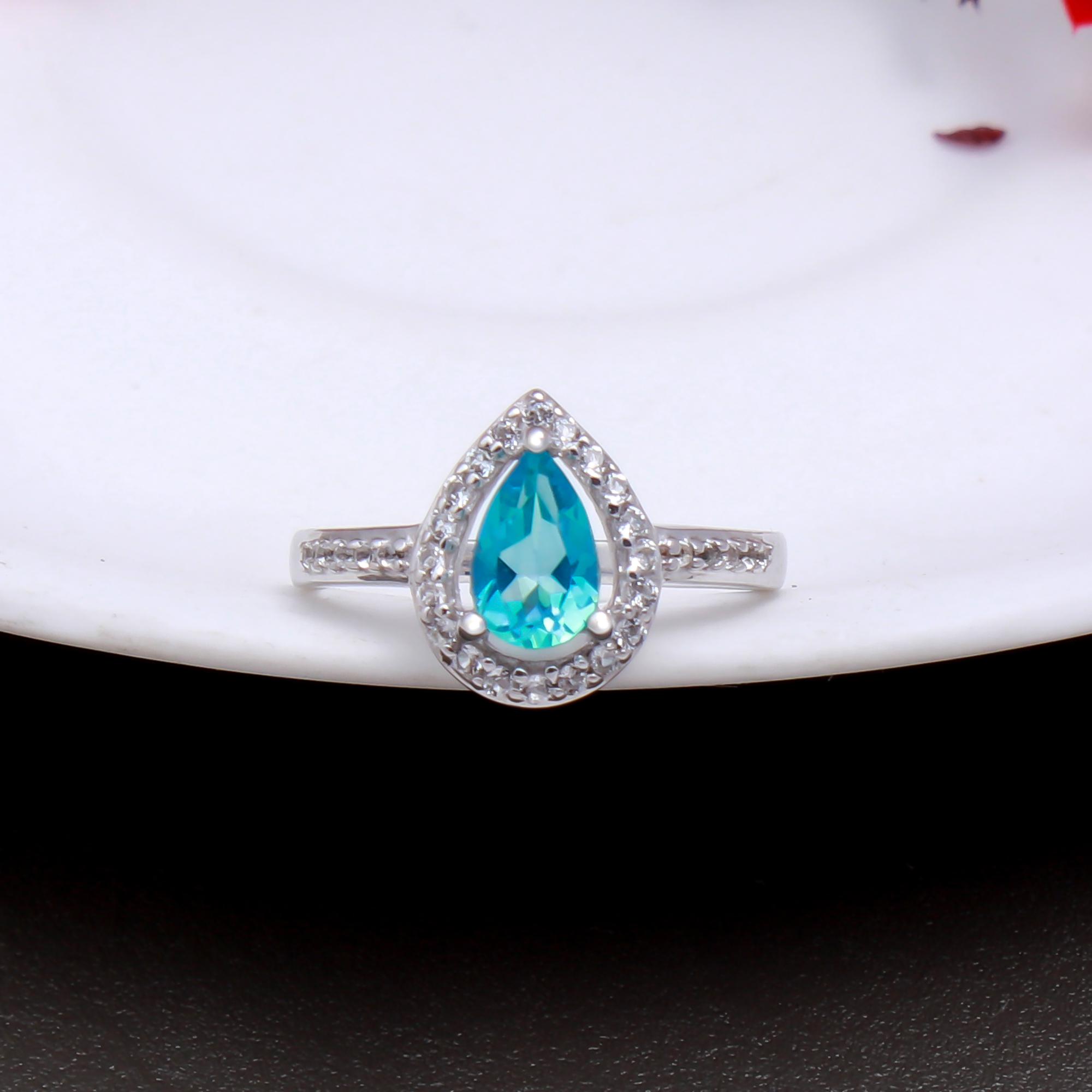 Swiss Blue Topaz Ring with Natural White Zircon