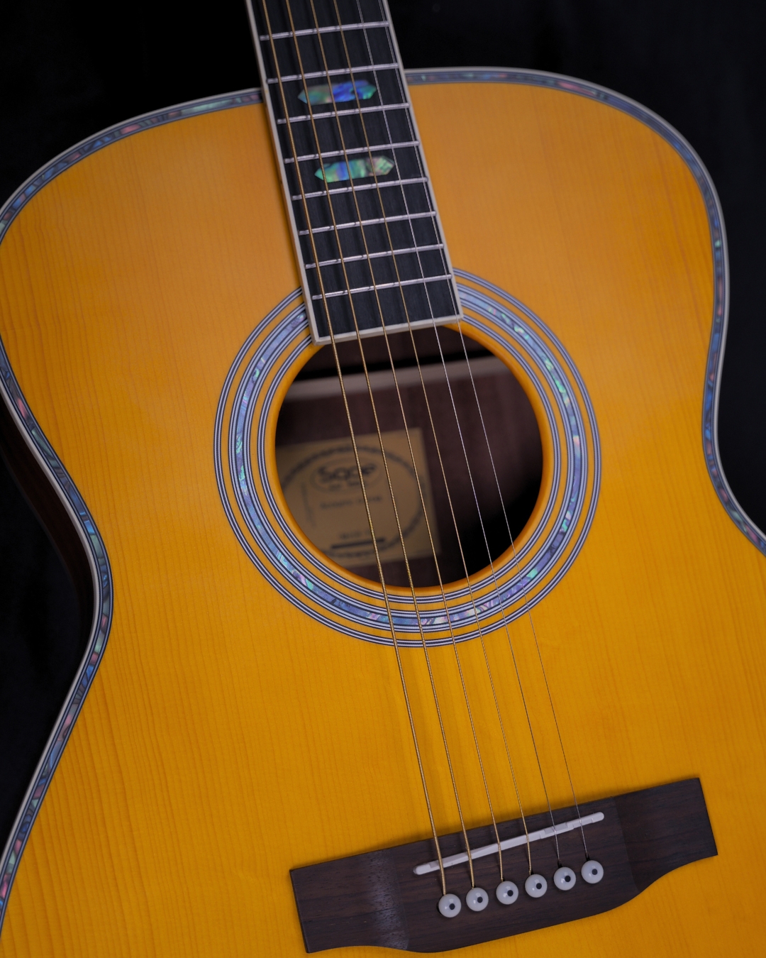 SQOE OM40B Solid Spruce Top OM Acoustic Guitar Vintage Yellow - soundhole and bridge close-up