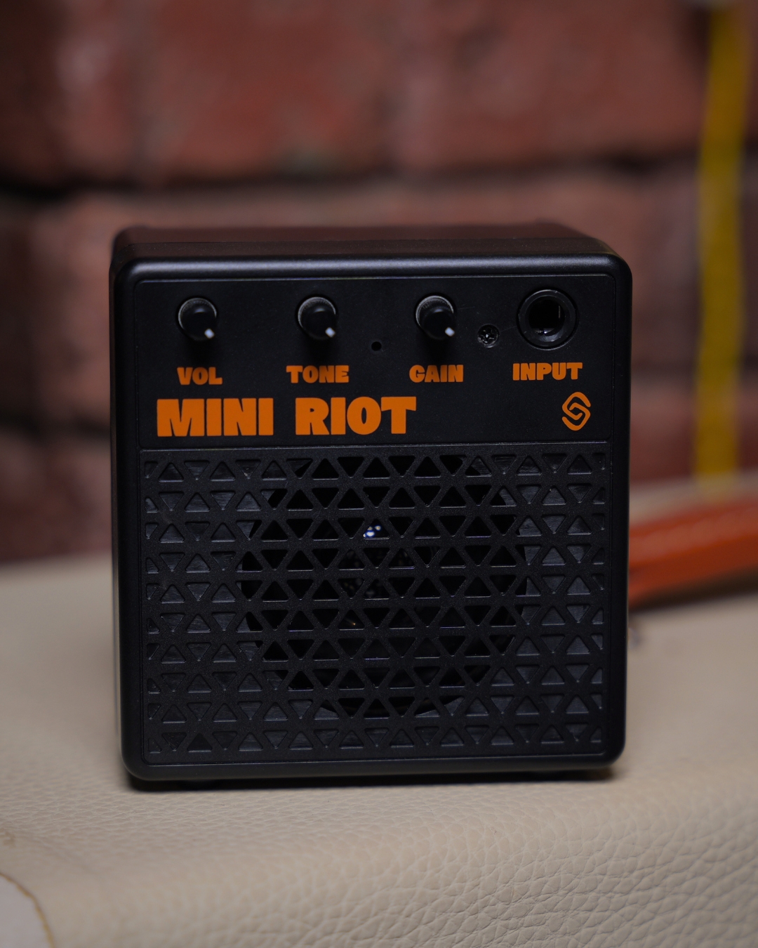 Strydom Mini Riot 8W Bluetooth Guitar Amplifier Coal - amp on stand lifestyle shot