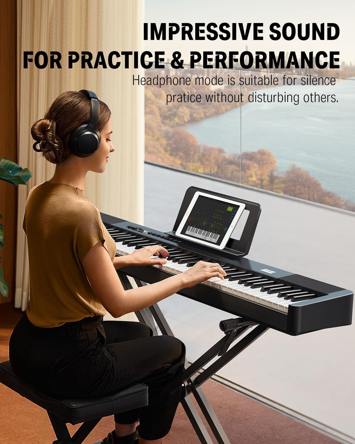 Tablet mounted on the Donner DEP-20 Lite stand for app-based practice with headphones