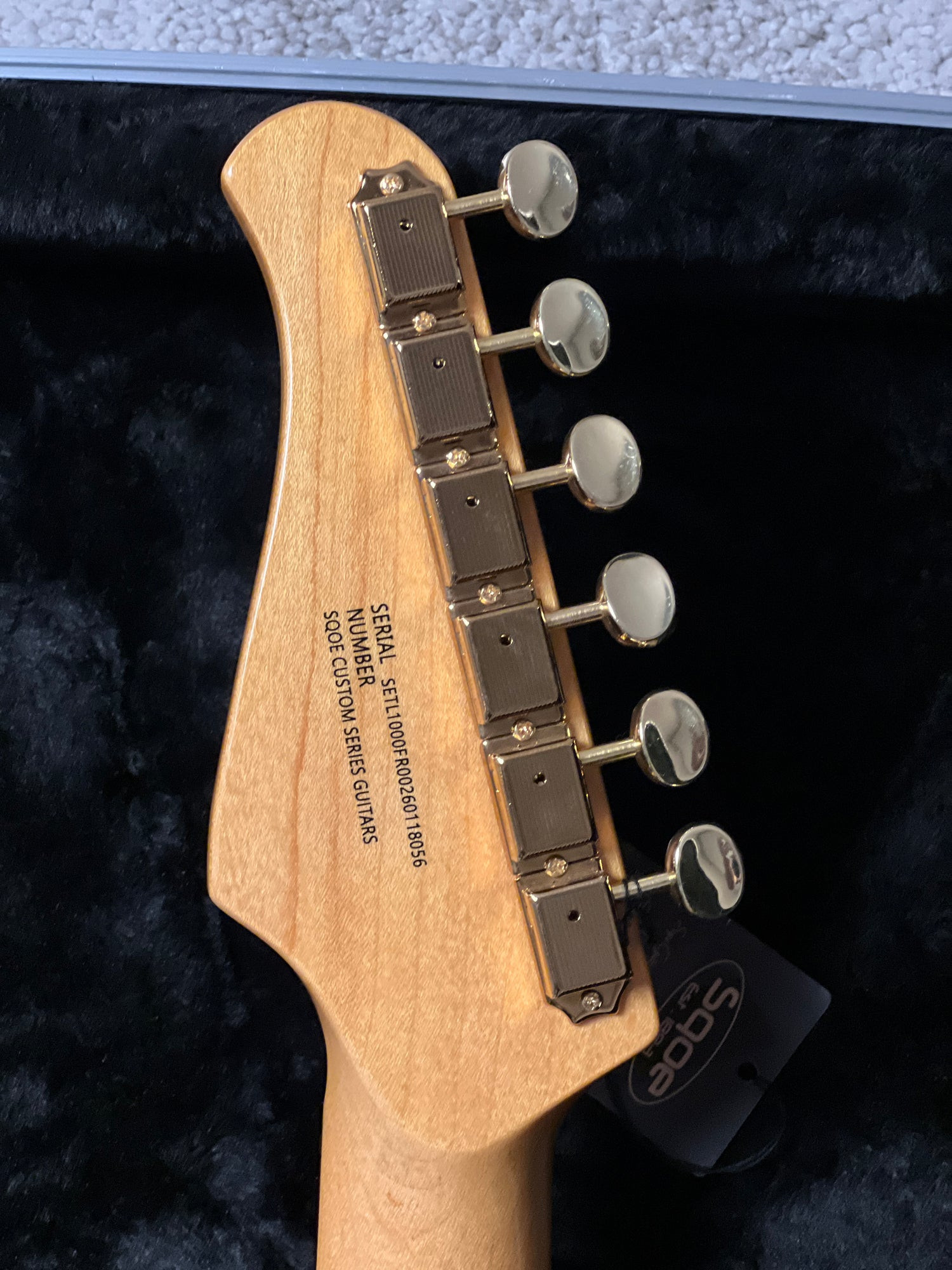 SQOE SETL1000FR Deep Sea Blue headstock rear with gold enclosed tuners