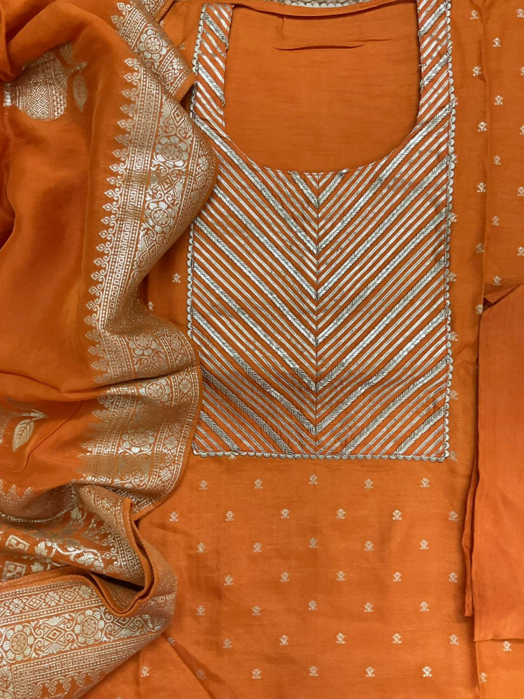 Image of Soft Dola Silk Banarasi Weaved Embroidered Suit - Orange