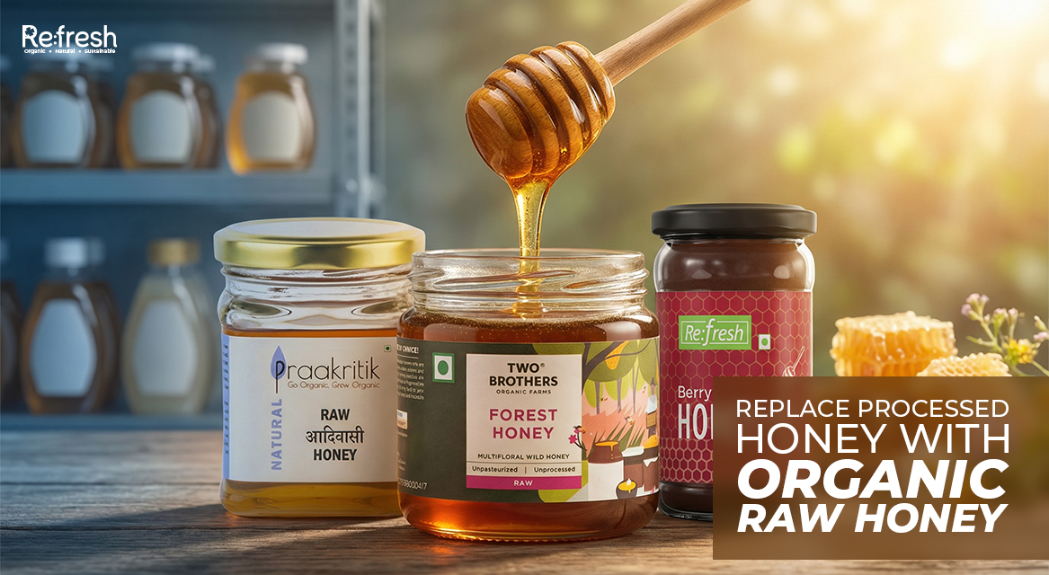 Jar of golden organic raw honey with dipper alongside Refresh Instant Coffee
