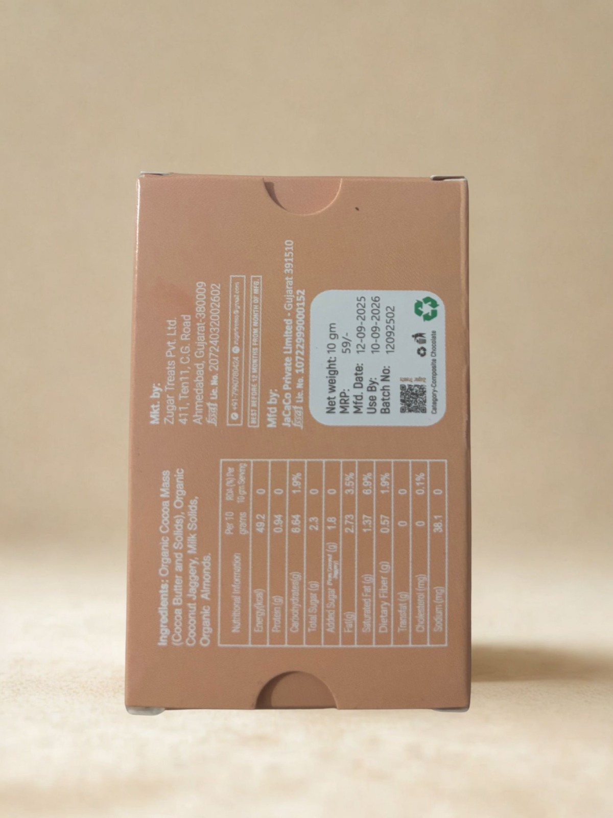 Back side of Zugar Roasted Almond Milk Chocolate box showing ingredients nutrition facts manufacturing details and 0 refined sugar claim