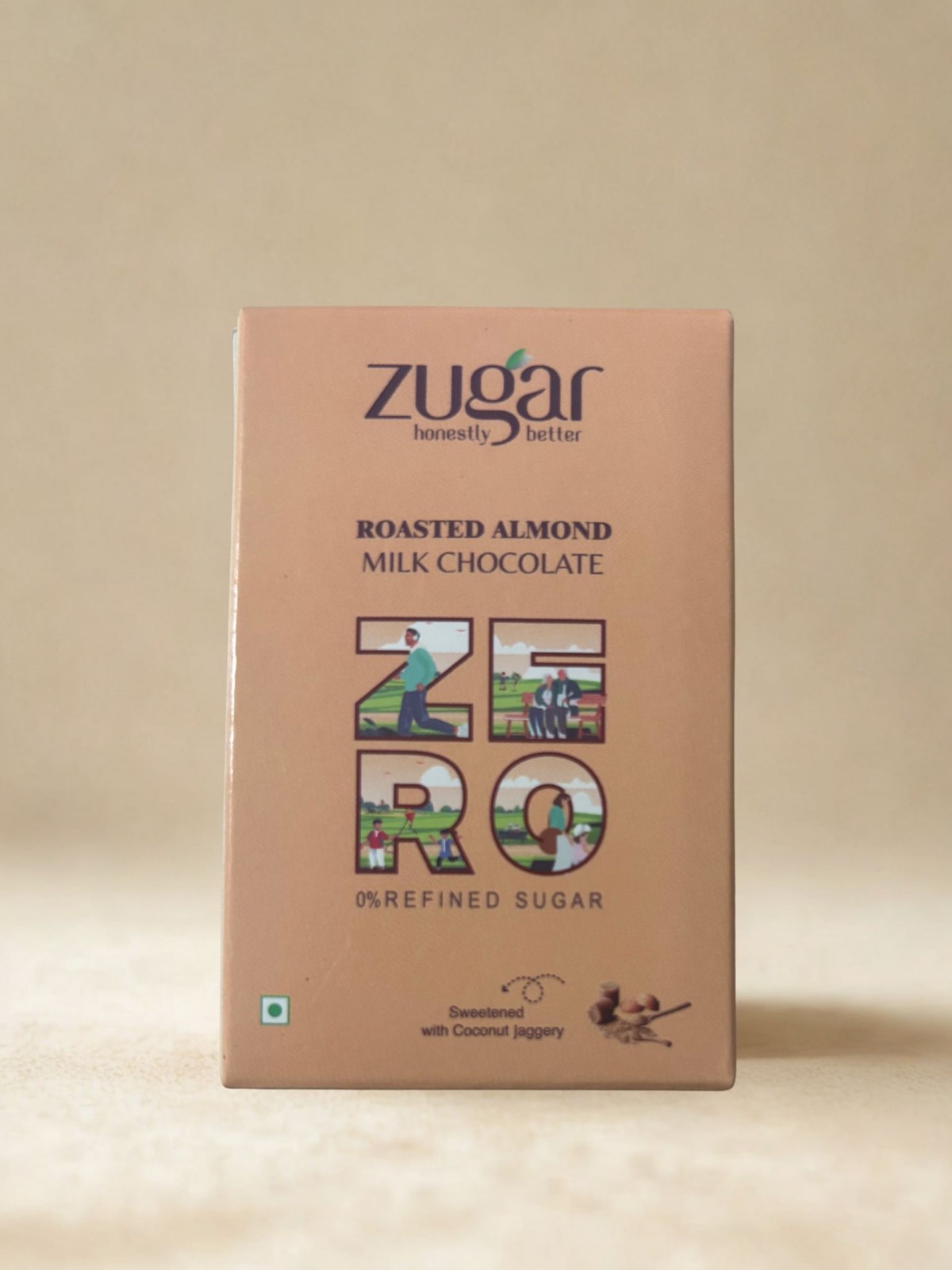 Front view of Zugar Roasted Almond Milk Chocolate highlighting ZERO refined sugar and sweetened with coconut jaggery on a beige background