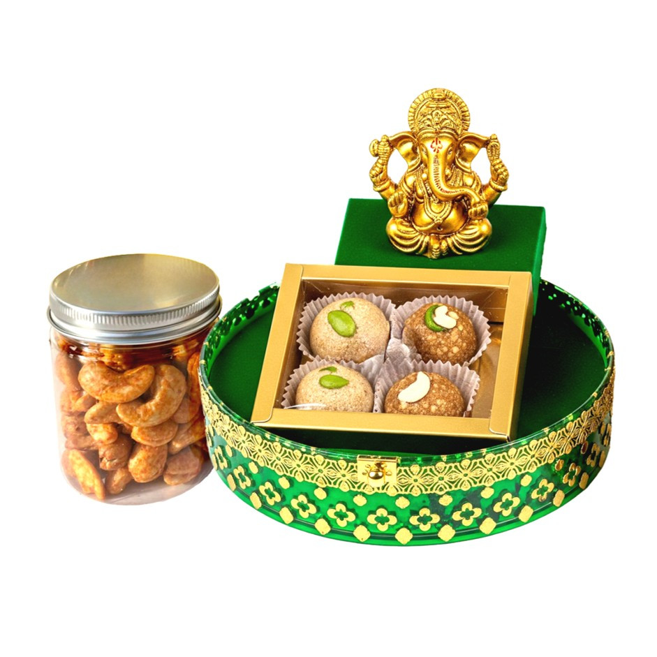 Decorated Green Transparent Box with 4 Nutty Laddus or Chikkis, 1 Jar & Gold-Plated Ganesha Idol | Festive Gift UAE