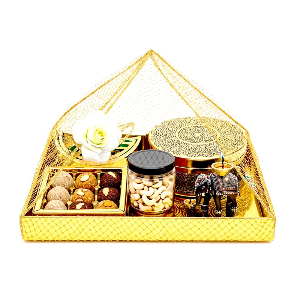 Gold Square Festive Tray with 9 Assorted Nutty Laddus, Royal Khorak or Pista Barfi in Stainless Steel Box, Peri-Peri Cashews Jar & Elephant Diya | Wrapped in Net | UAE