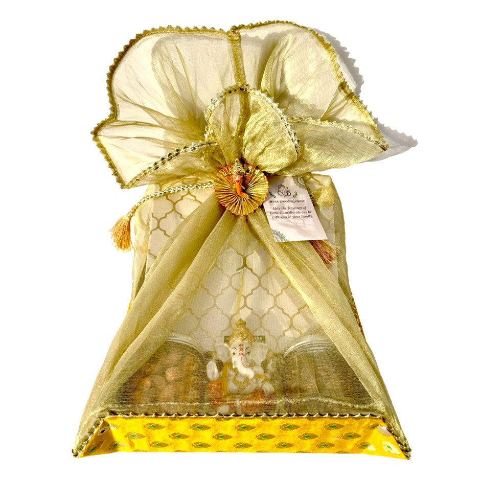Festive Fabric Hamper with Assorted Nutty Laddus & Date Bites, 2 Jars – Chili Lime Pistachios & Peri-Peri Cashews with Gold-Plated Ganesha | Wrapped with Net | Festive Gift UAE