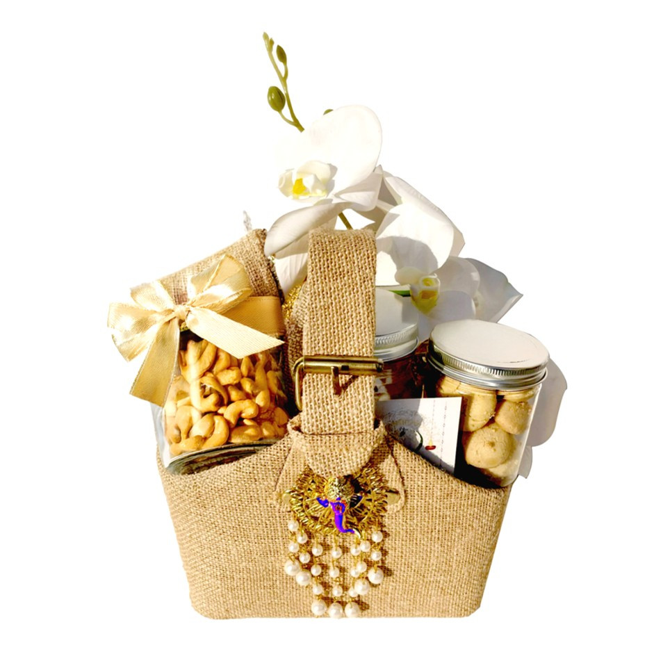 Premium Jute Big Basket with Assorted Nutty Laddus & Date Bites, 4 Jars – Nankhatais, Seven Seed Mukhwas, Peri-Peri Cashews & Chili Lime Pistachios or Gold-Plated Ganesha | Floral Decor | Festive Gift UAE