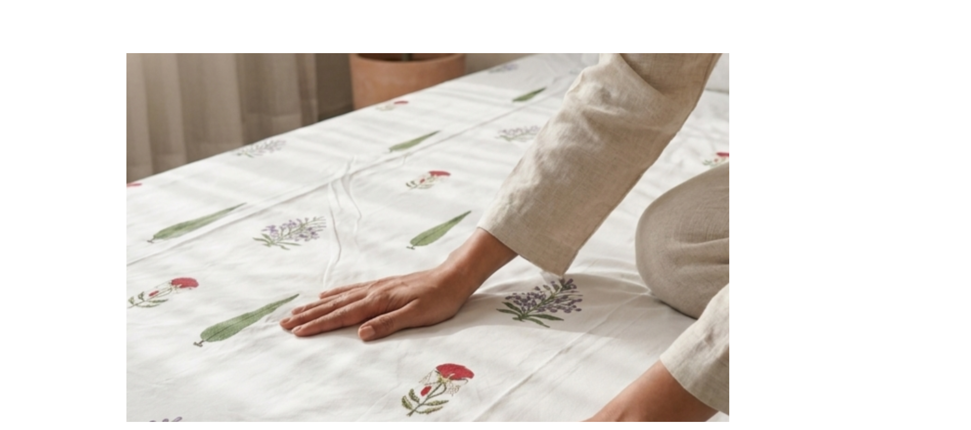 Hand block print bedsheets displayed on traditional Indian bed with wooden carved headboard showing Jaipuri textile design