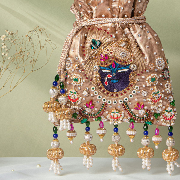 Golden Jewellery Shrinathji Tissue Potli | Regal Hand-Embroidered Wedding Potli