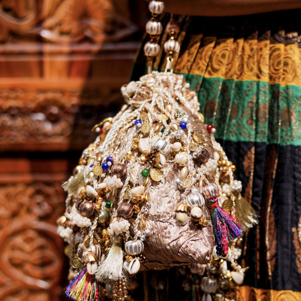 Iconic Antique Gold Crushed Tissue Potli Bag with Embellished Fringes